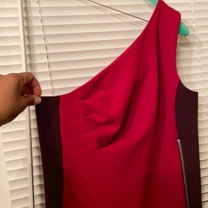 Med size stretch material red and purple dress great for any occasion.